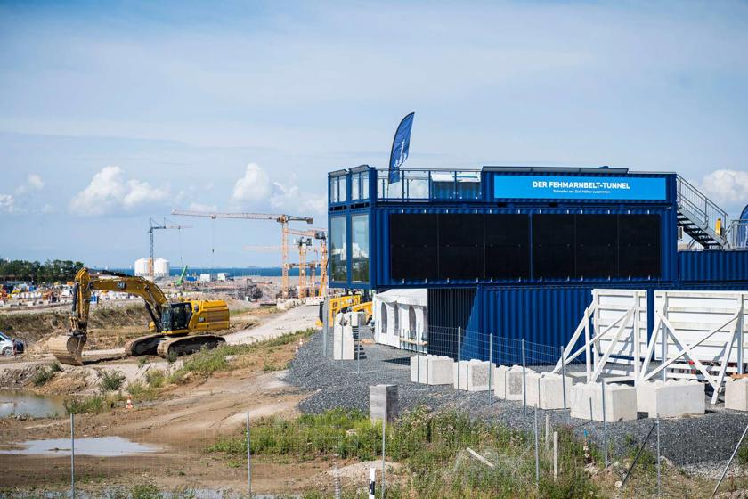 EN: The new viewing platform made from stacked blue containers next to the German tunnel construction site. // DE: Der neue Aussichtspunkt aus aufeinandergestapelten blauen Containern neben der deutschen Tunnelbaustelle. // DA: Det nye udsigtspunkt lavet af blå containere stablet oven på hinanden ved siden af den tyske tunnelbyggeplads.